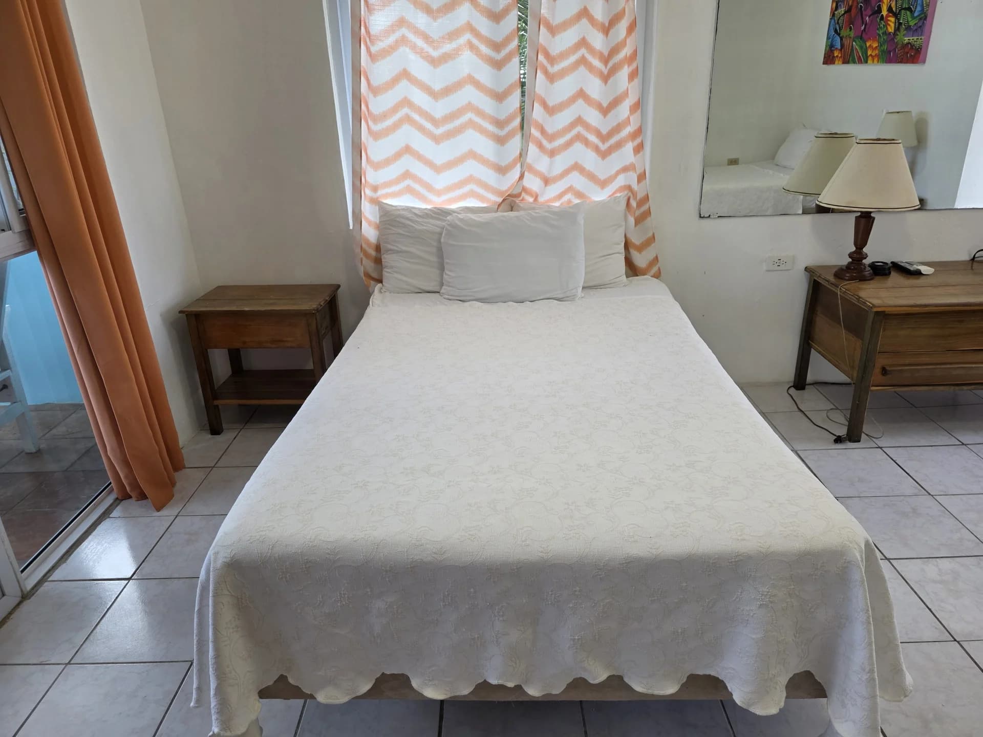 Two double beds with crisp white linens in Seaview Deluxe Room 2