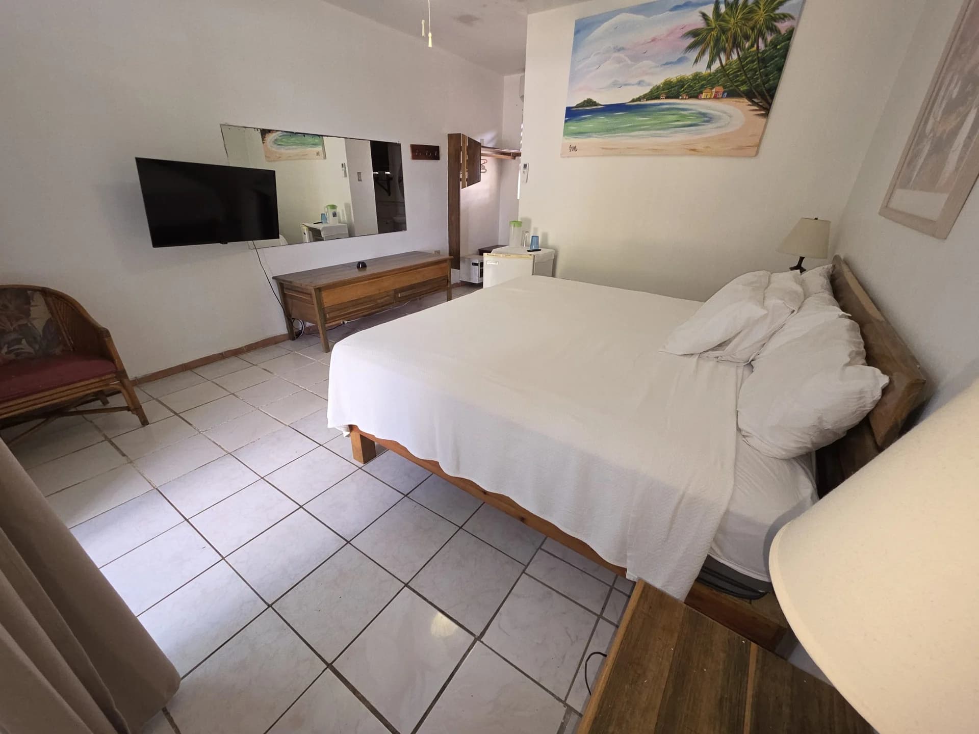 King bed with sea-view balcony doors in Seaview Deluxe King Room 7