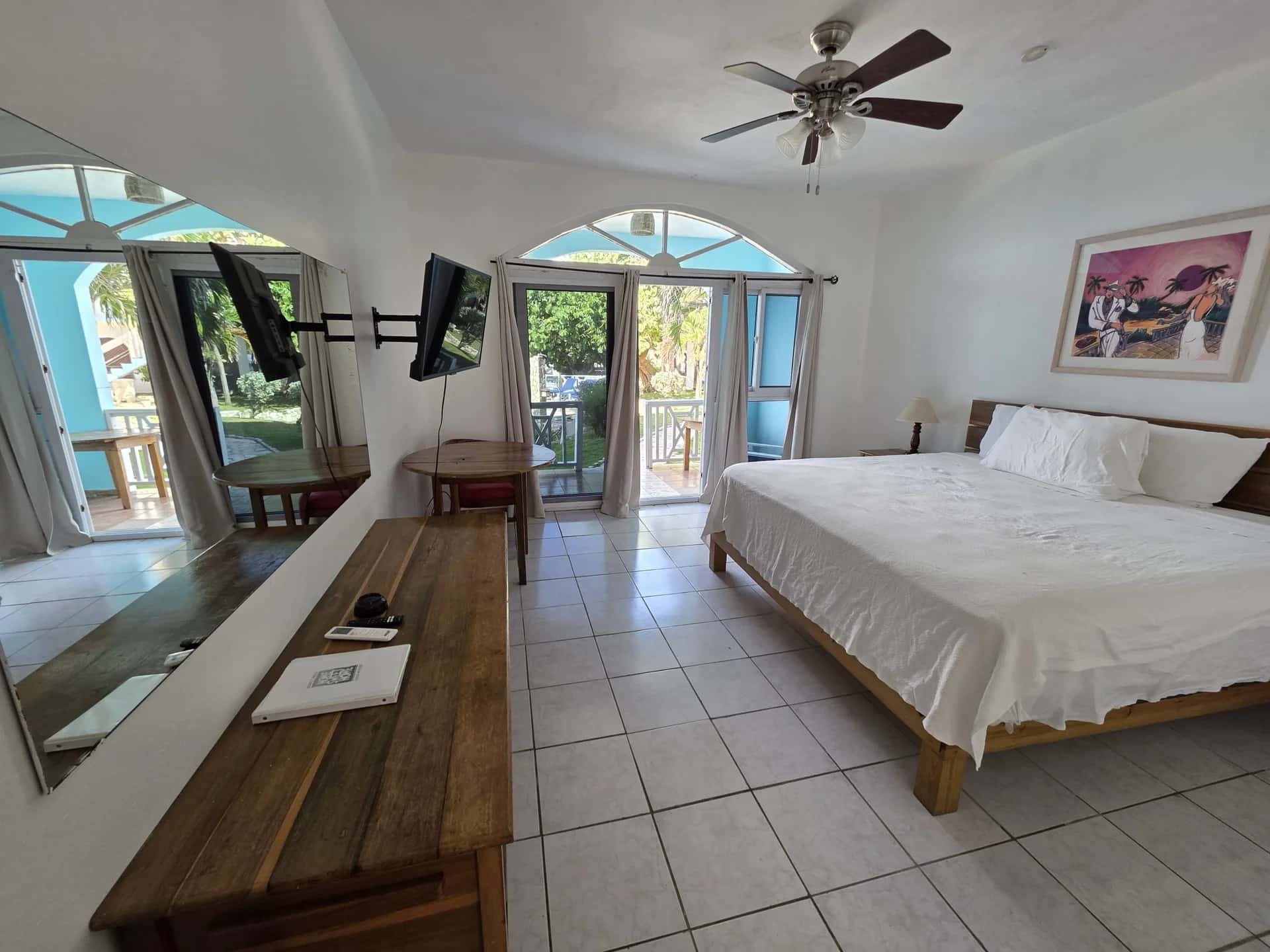King bed with sea-view balcony doors in Seaview Deluxe King Room 9