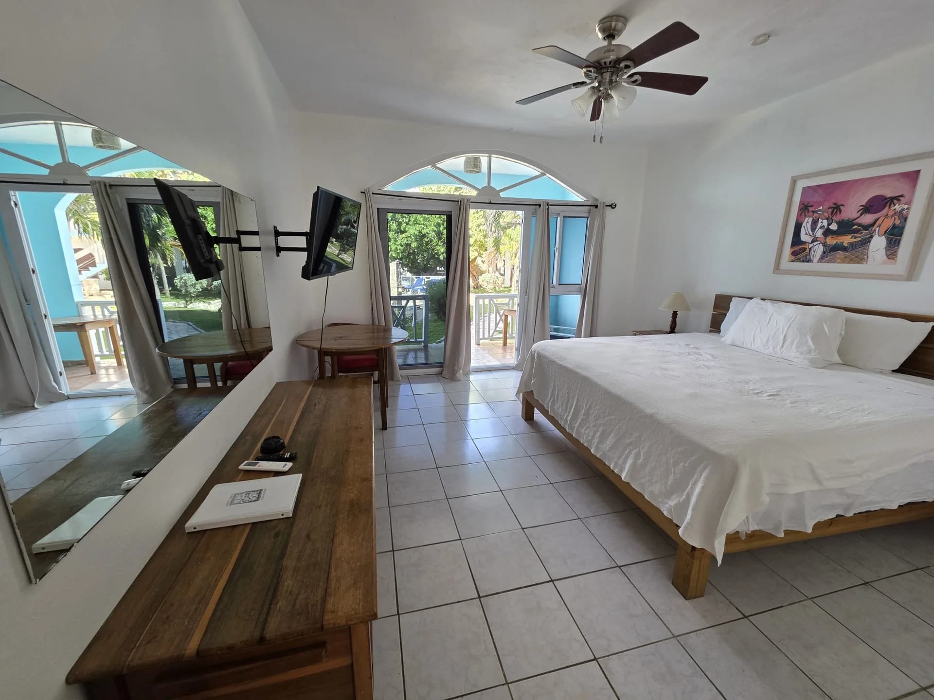 King bed with sea-view balcony doors in Seaview Deluxe King Room 9